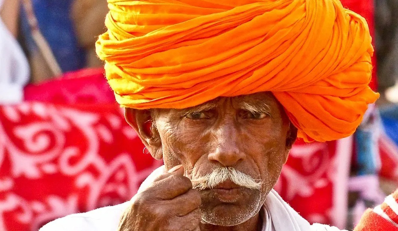 A man with a turban on his head.