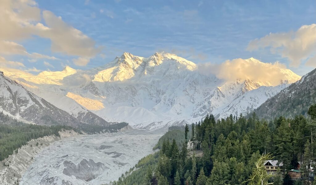 A mountain range with snow on it and trees.