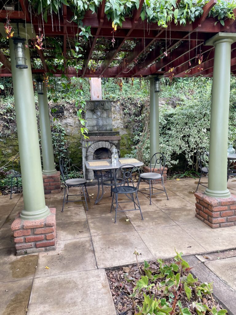 A green and blue clock with the time 1 2 : 3 0.