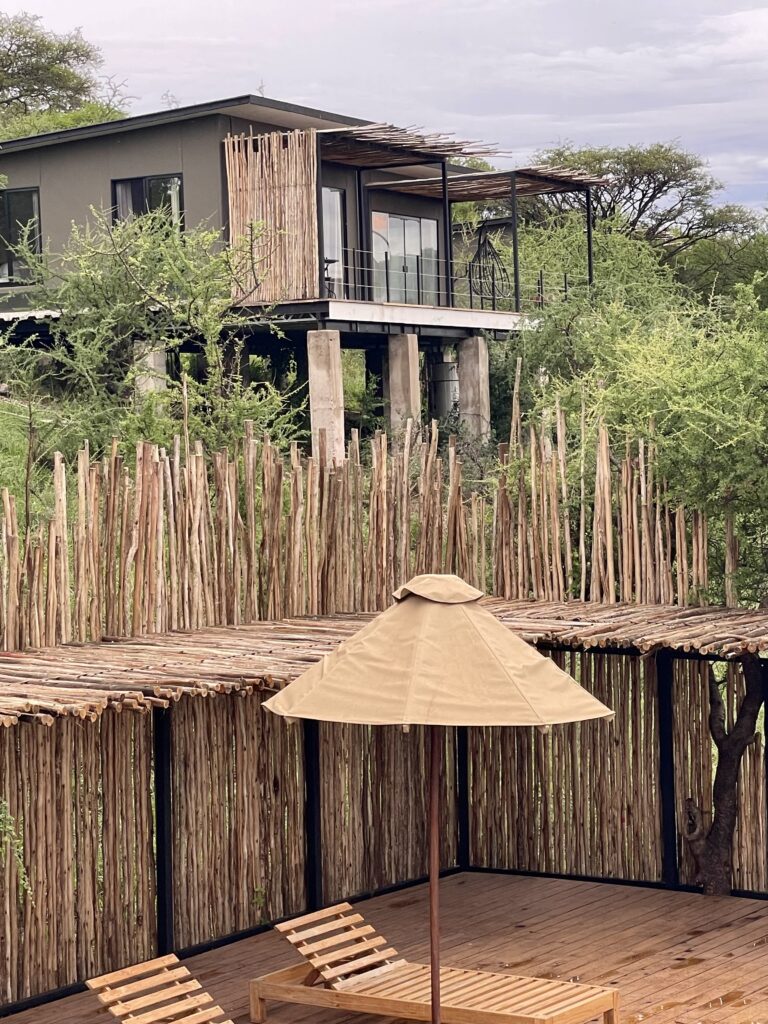 A green and blue clock with the time 1 2 : 3 0.