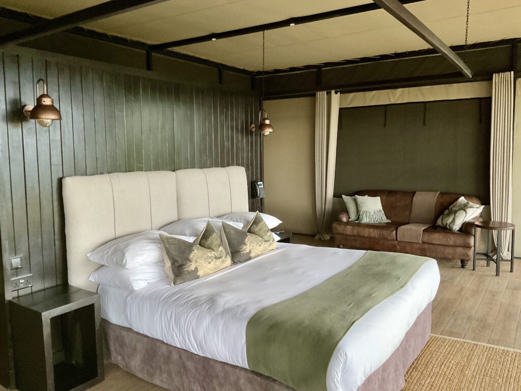 A green and blue clock with the time 1 2 : 3 0.