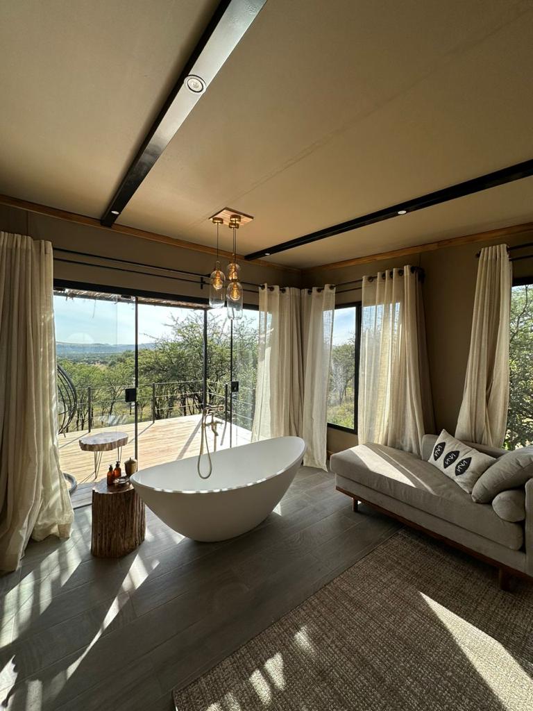 A green and blue clock with the time 1 2 : 3 0.