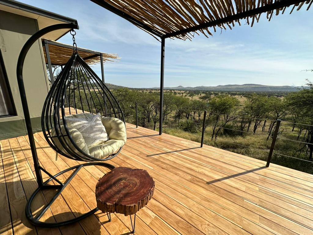 A green and blue clock with the time 1 2 : 3 0.