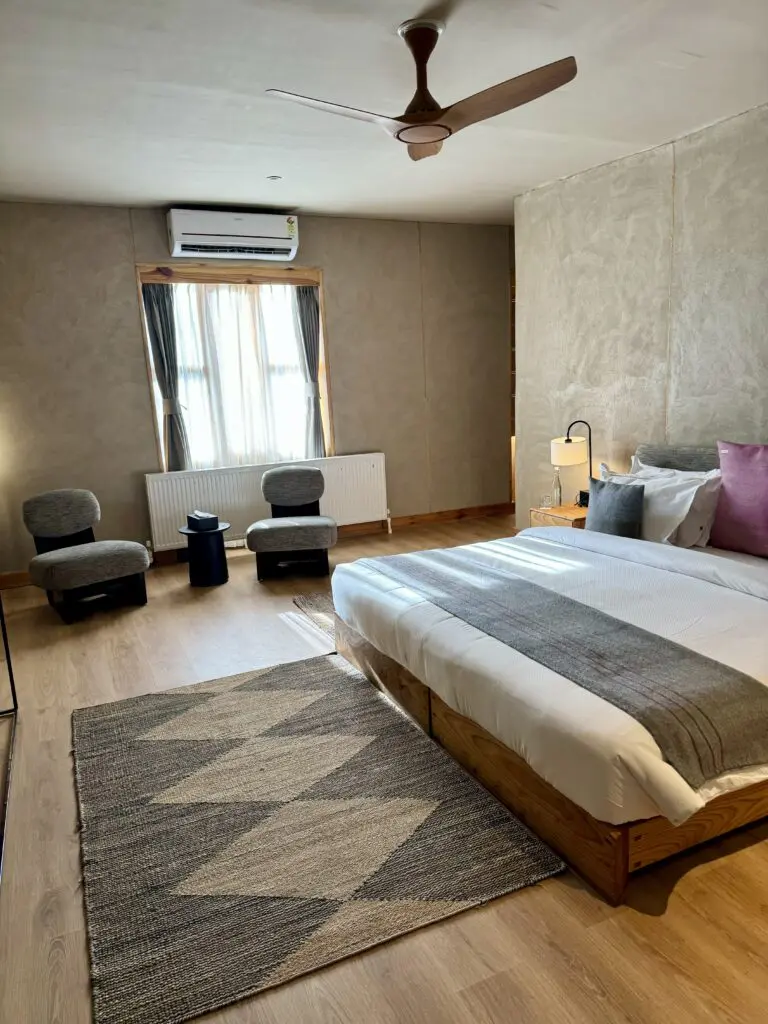 A green and blue clock with the time 1 2 : 3 0.