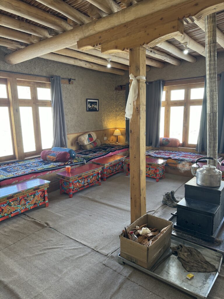 A green and blue clock with the time 1 2 : 3 0.