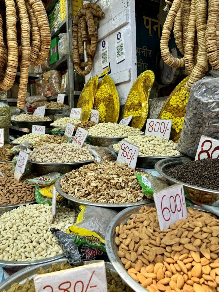 A green and blue clock with the time 1 2 : 3 0.