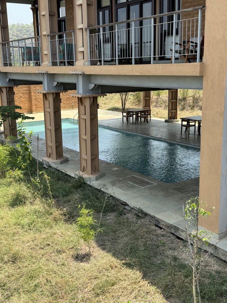 A green and blue clock with the time 1 2 : 3 0.