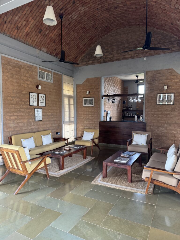 A green and blue clock with the time 1 2 : 3 0.