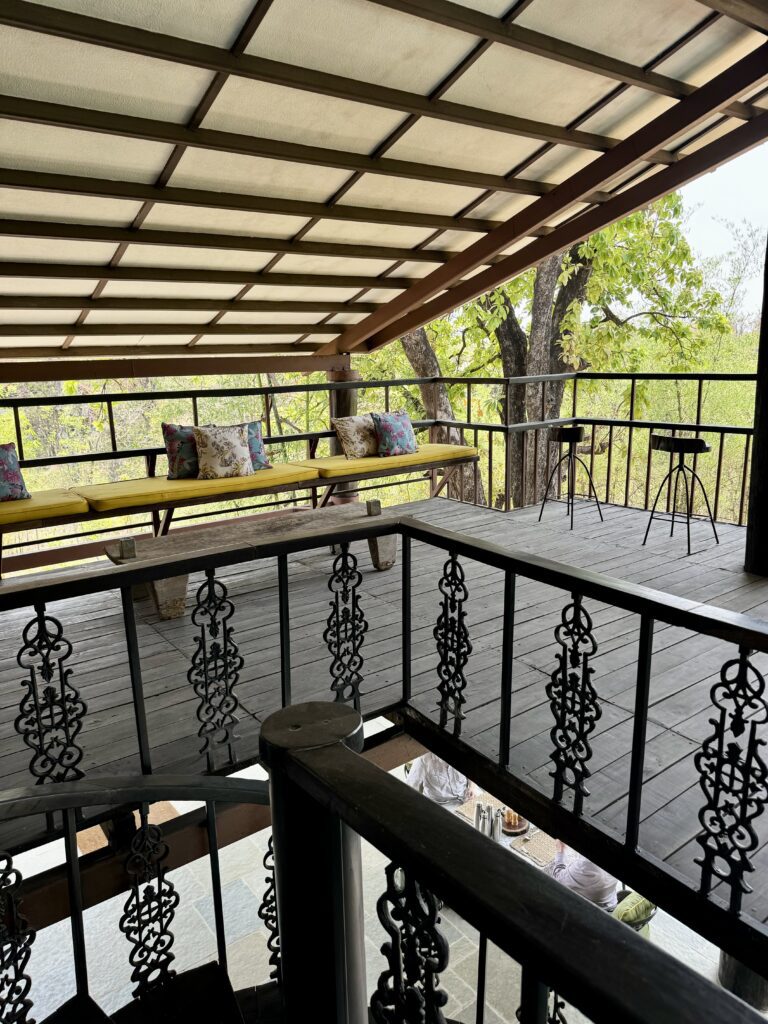 A green and blue clock with the time 1 2 : 3 0.