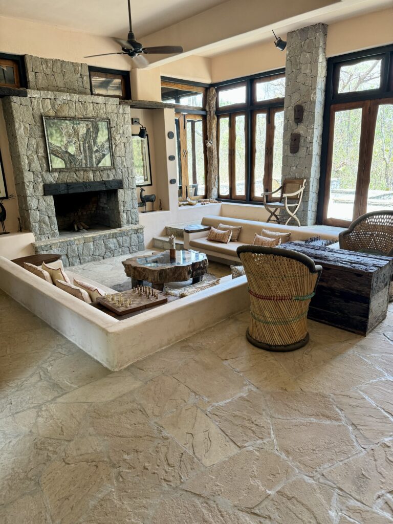 A green and blue clock with the time 1 2 : 3 0.