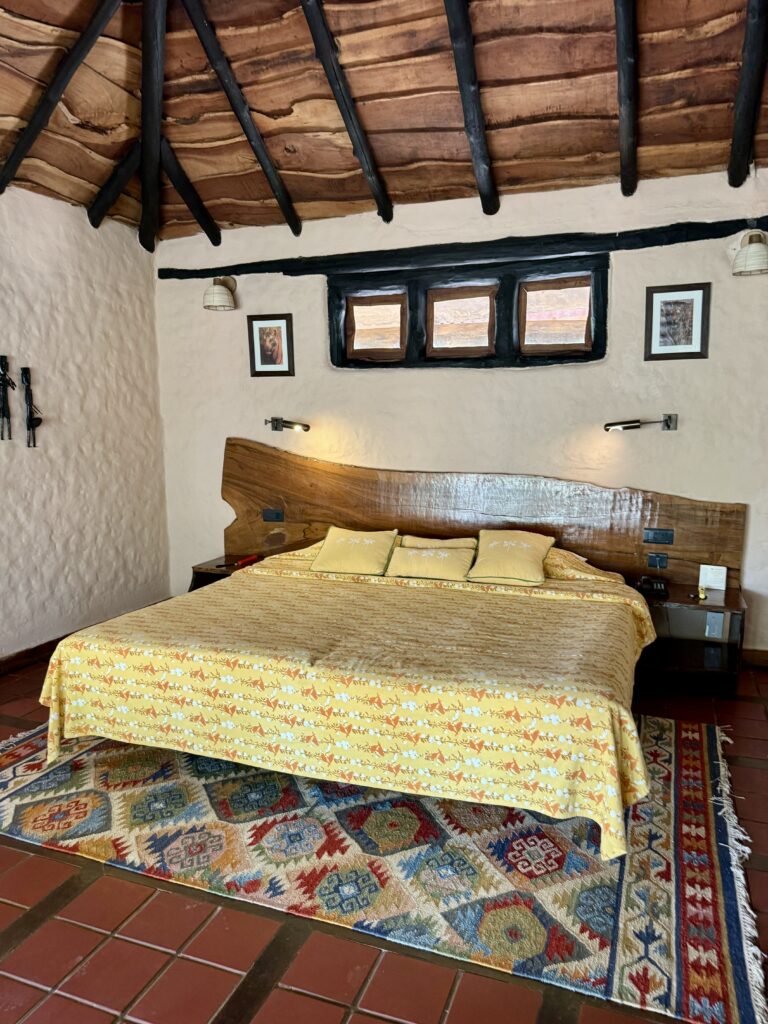 A green and blue clock with the time 1 2 : 3 0.