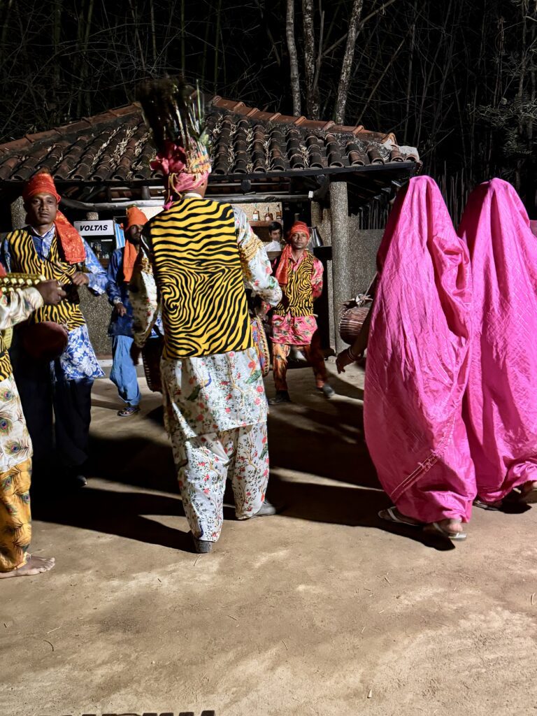 A green and blue clock with the time 1 2 : 3 0.