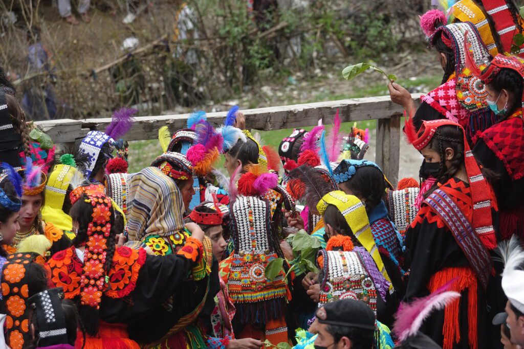 A group of people in colorful costumes and hats.