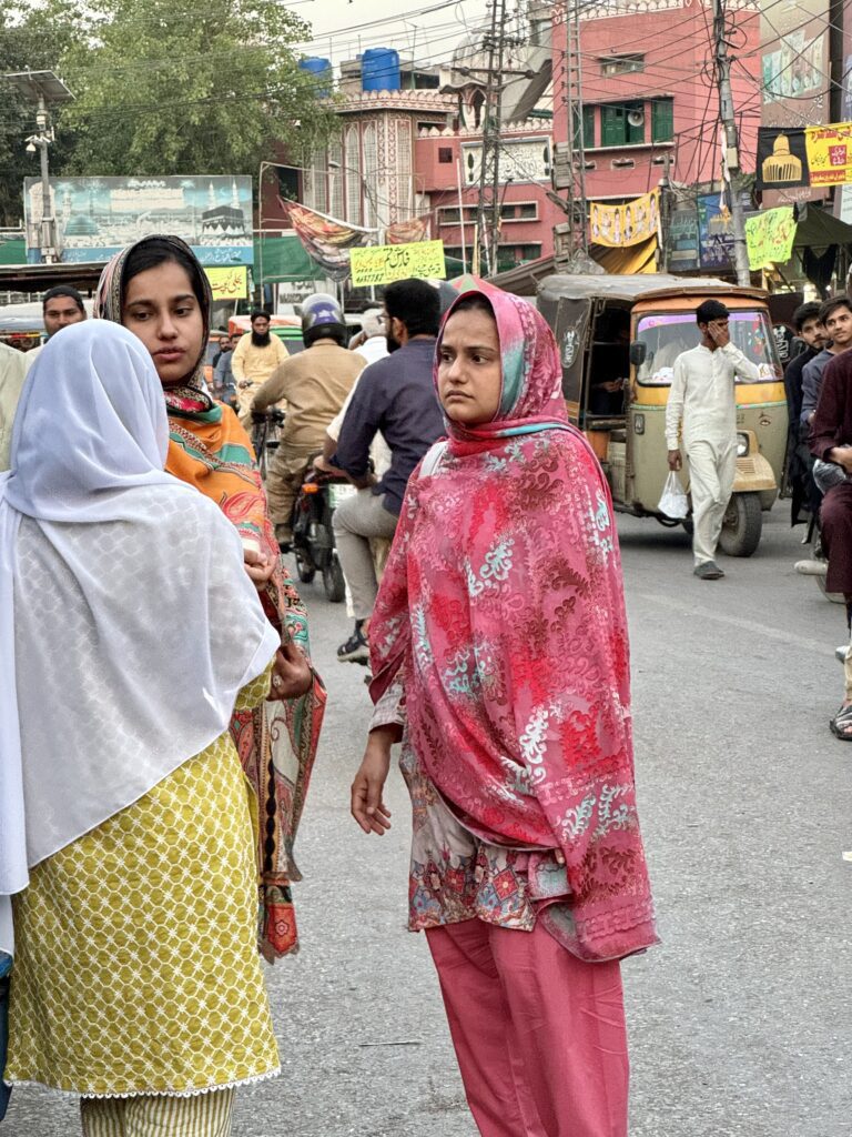 A group of people walking down the street.