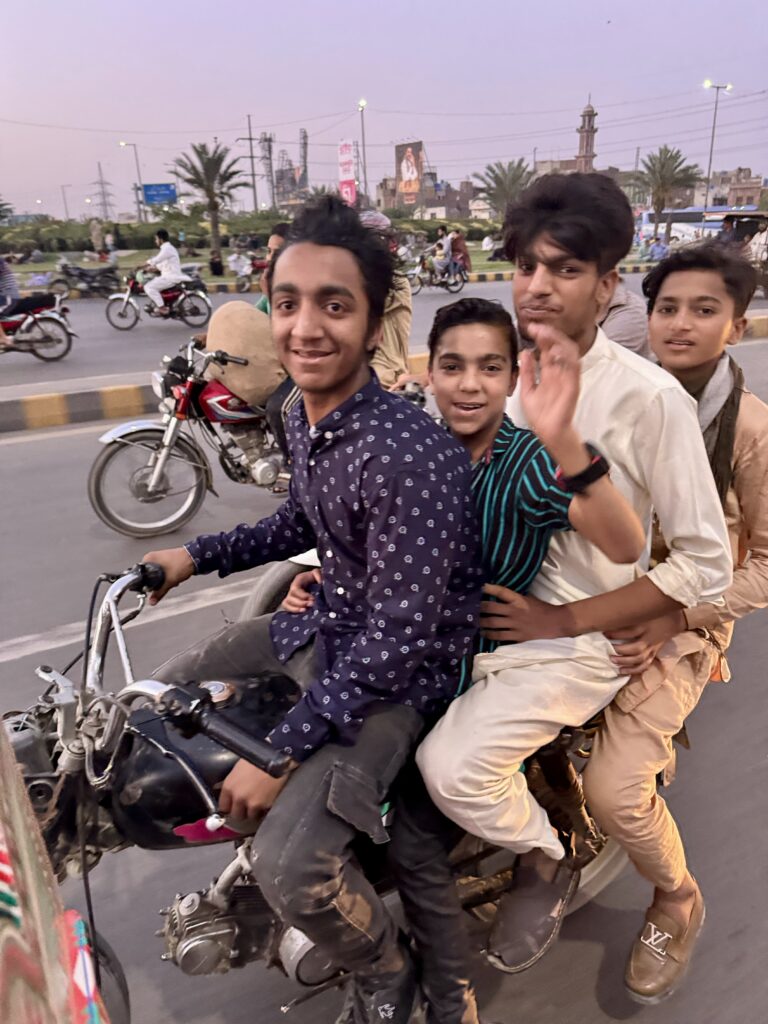 A group of men riding on the back of motorcycles.