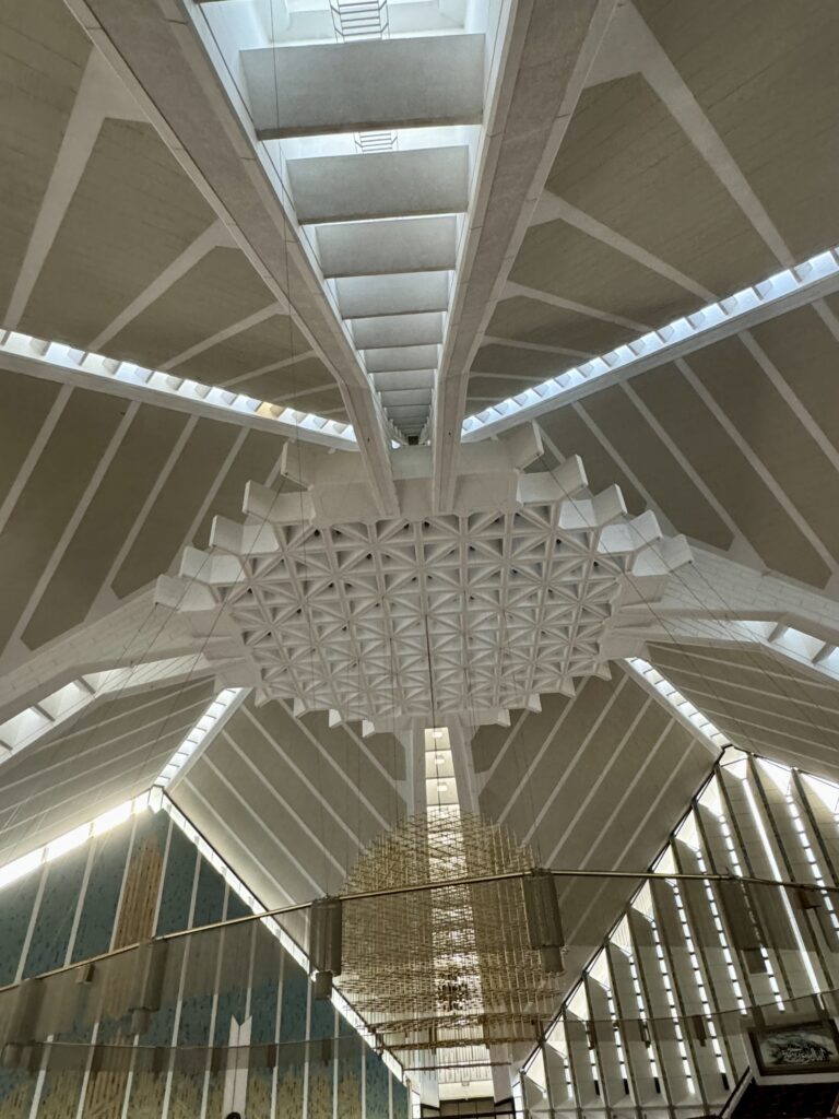 A ceiling with lights and a large white structure.