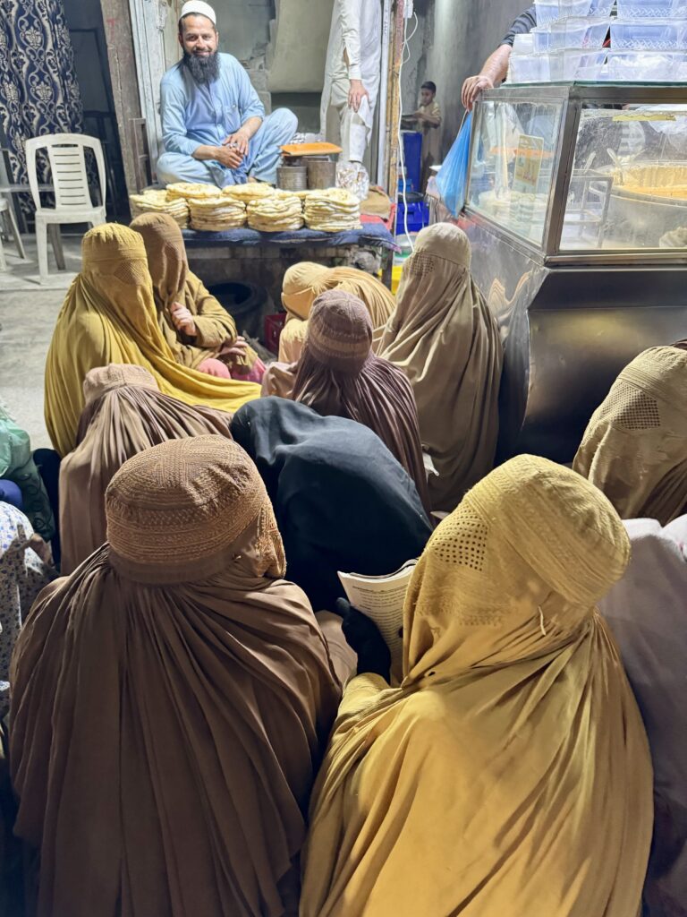 A group of people sitting in a room.