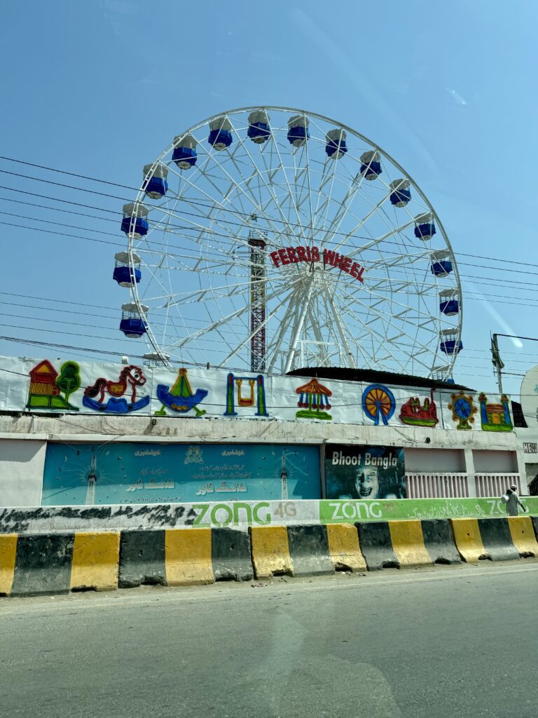 A ferris wheel with many decorations on it
