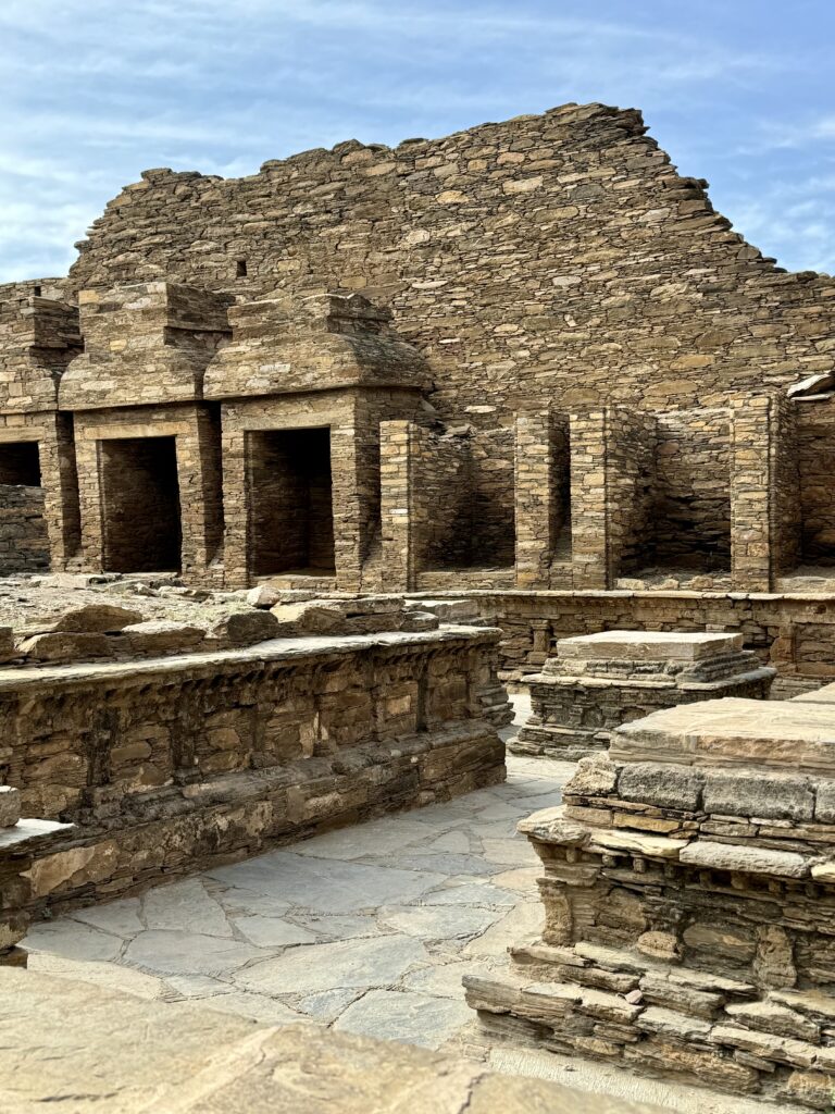 A stone building with many steps and pillars.