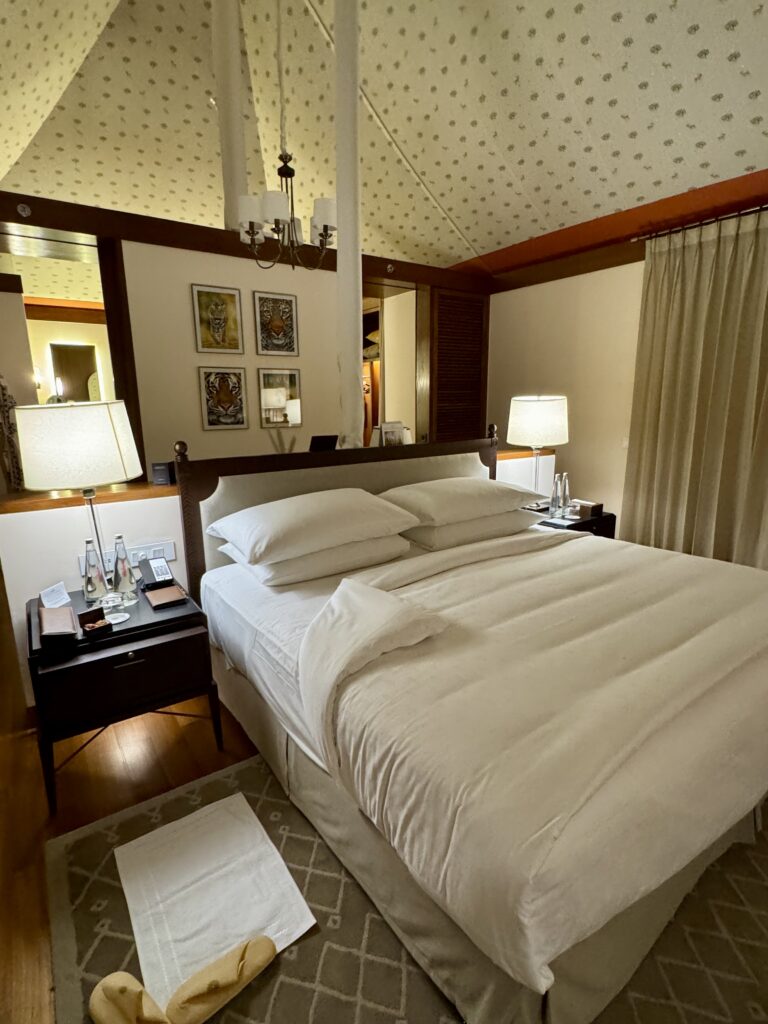 Cozy bedroom with warm lighting and elegant decor.